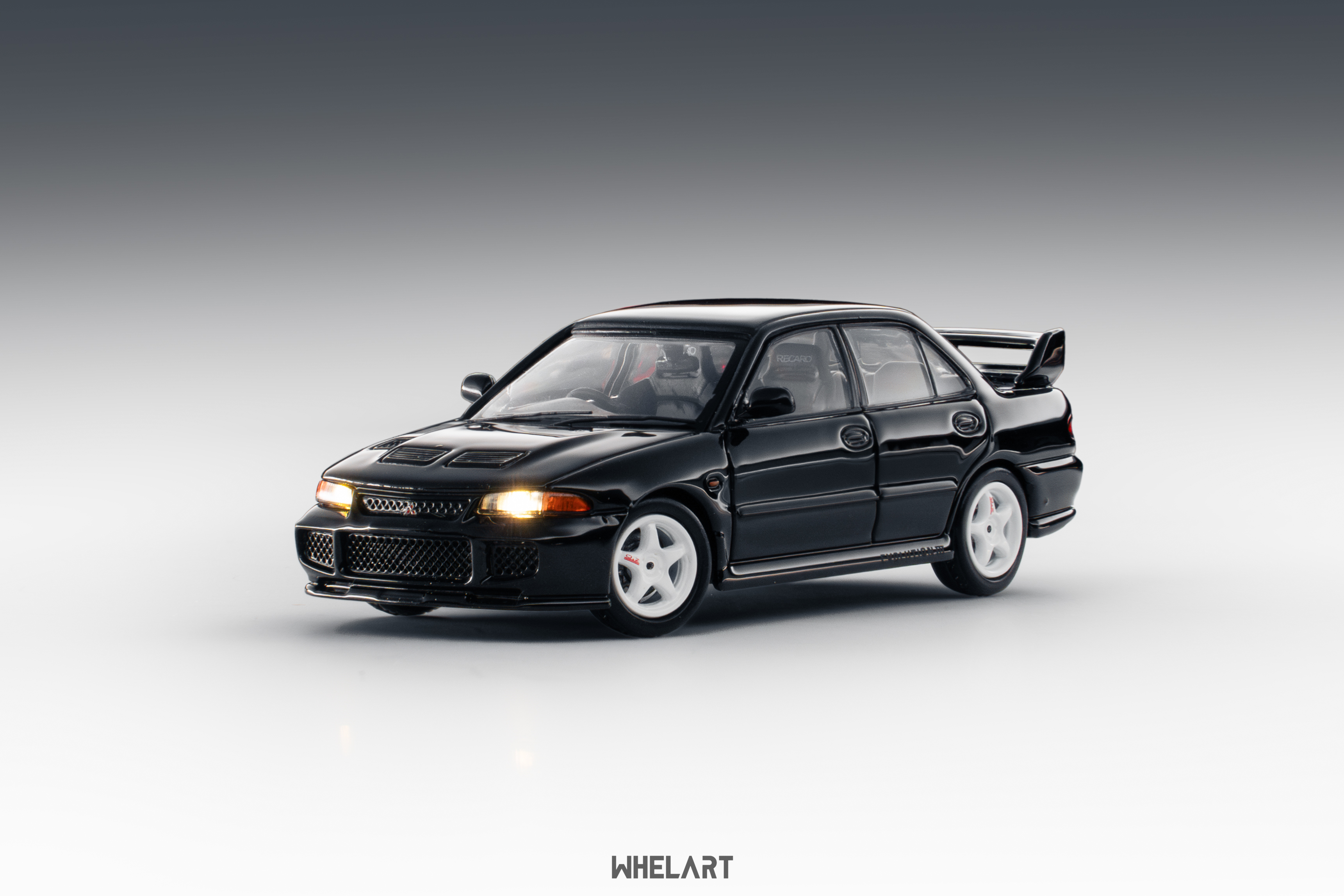 WHELART 1:64 Mitsubishi EVO III (Black, with lighting function)